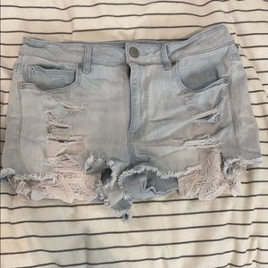 Destressed denim shorts